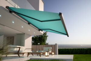 Retractable teal awning over furniture