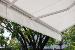 White retractable awning near trees